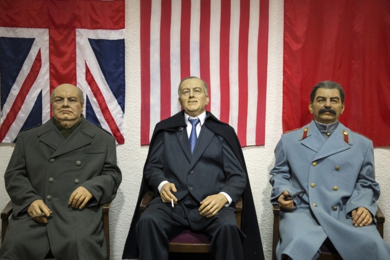 Wax figures of (L-R) former British prime minister Winston Churchill, former U.S. president Franklin Roosevelt and former leader of the Soviet Union Joseph Stalin, who were participants of the Yalta Conference in February 1945, are displayed at Livadia Palace outside the town of Yalta, Crimea, March 17, 2015.