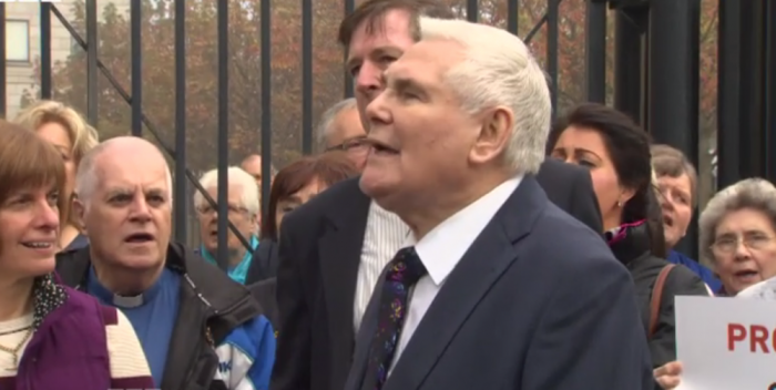 British Pastor James McConnell is joined by supporters outside of Belfast Magistrates Court on October 1, 2015 after a trial date for his comments about Islam was set.