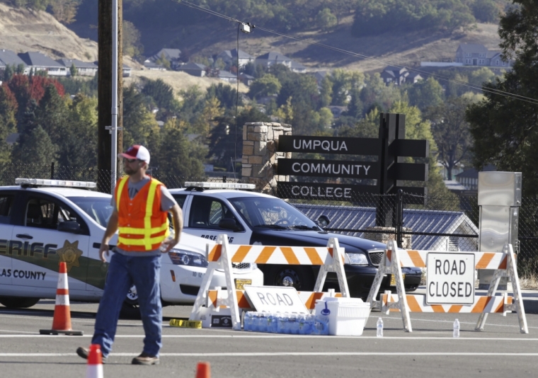 Police cruisers block the entrance to the site of a mass shooting at Umpqua Community College in Roseburg, Oregon, October 1, 2015. A gunman opened fire at a community college in southern Oregon on Thursday, killing 13 people and wounding some 20 others before he was shot to death by police, state and county officials said, in the latest mass killing to rock a U.S. school. There were conflicting reports on the number of dead and wounded in the shooting rampage in Roseburg, which began shortly after 10:30 a.m. local time.
