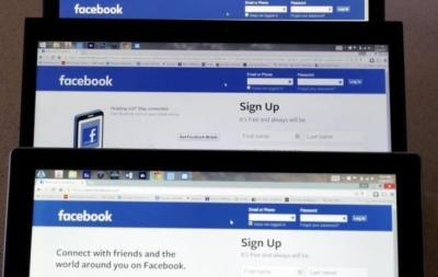 Computer screens display the Facebook sign-in screen in this photo illustration taken in Golden, Colorado July 28, 2015.