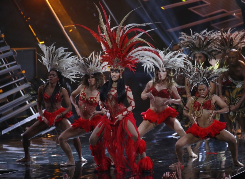 Rap artist Nicki Minaj (with microphone) performs "Trini Dem Girls" at the 2015 MTV Video Music Awards in Los Angeles, California, August 30, 2015.