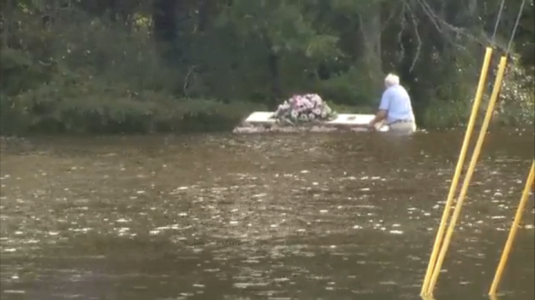 Pastor Wayne Reeves of Summerville, South Carolina, retrieves a burial casket on October 4, 2015, amid historic deadly flooding caused by rainfall from Hurricane Joaquin that's affecting 11 counties in the state.