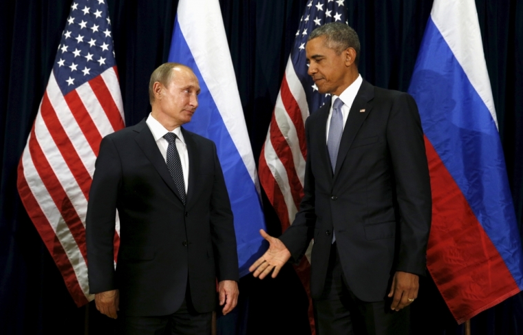 U.S. President Barack Obama extends his hand to Russian President Vladimir Putin during their meeting at the United Nations General Assembly in New York, September 28, 2015.