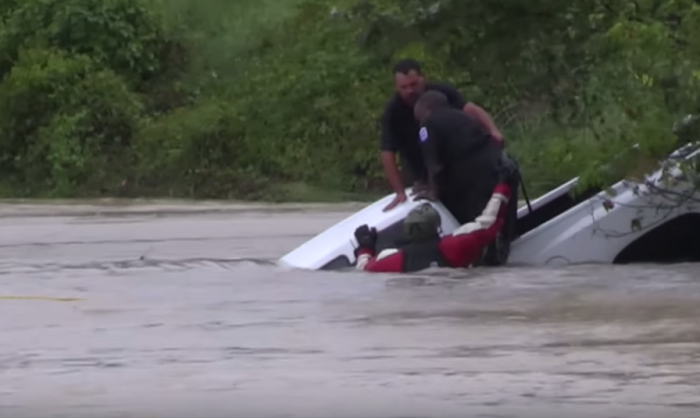 Weather Nation TV captures footage of the water rescue of two men stranded on a pickup truck.