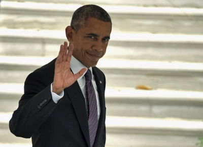 U.S. President Barack Obama waves to the media as he departs the White House in Washington for a day trip to an event at the National Fallen Firefighters Memorial, in Emmittsburg, Maryland, October 4, 2015. Obama will attend a service to honor 84 heroic firefighters who died in 2014 and others from previous years.