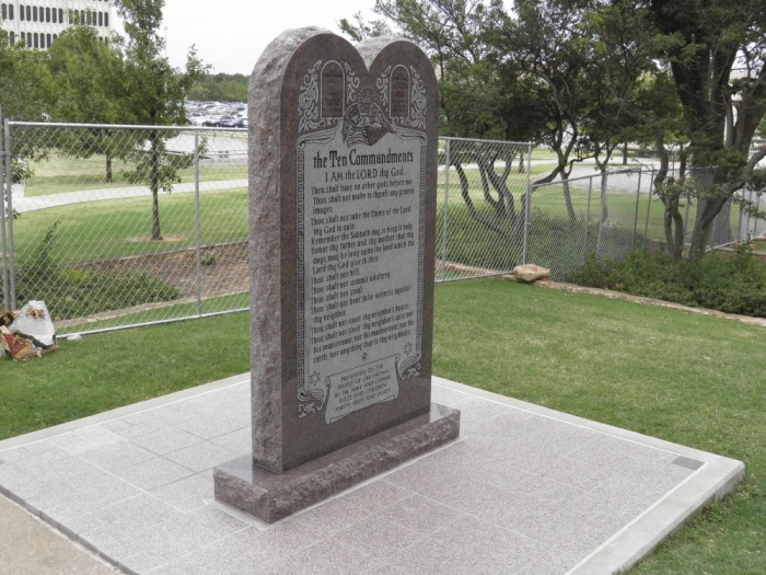 A Ten Commandants monument is seen in a fenced-off section of Oklahoma State Capitol grounds in Oklahoma City, Oklahoma, September 30, 2015. The Republican Party of Oklahoma has offered a home to a Ten Commandments monument soon to be removed from Capitol grounds for violating state law, saying its teaching are espoused by the party, officials said on Thursday.