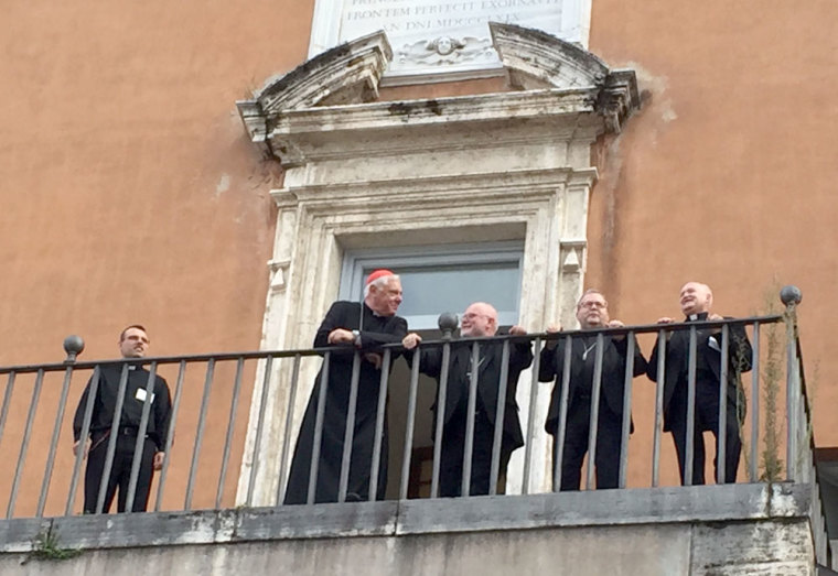Cardinals Müller and Marx and other members of the German discussion group of the synod on the balcony of the Congregation of Faith in front of the central room on October 8, 2015.