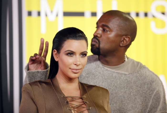 TV personality Kim Kardashian and musician Kanye West arrive at the 2015 MTV Video Music Awards in Los Angeles, California, August 30, 2015.