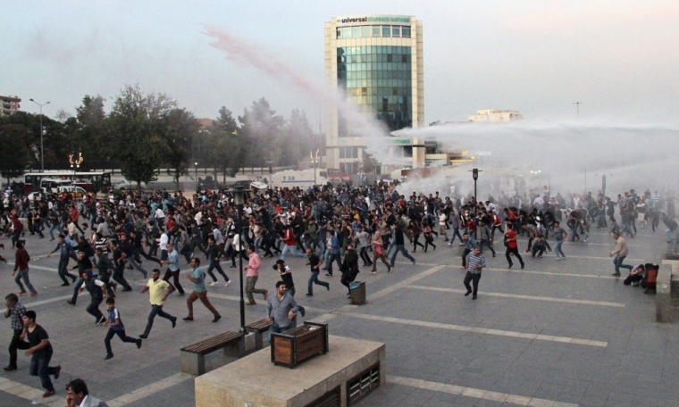 Police in Diyarbakir, Turkey, on October 11, 2015, use tear gas and water cannon to disperse people marching to protest the double suicide bombing in Ankara that killed up to 128 people. Turkey is targeting Islamic State in investigations of a double suicide bombing in Ankara that killed up to 128 people, officials said on Sunday, while opponents of President Tayyip Erdogan blamed him for the worst such attack in Turkish history. Government officials made clear that despite alarm over the attack on a rally of pro-Kurdish activists and civic groups, there would be no postponement of November polls Erdogan hopes can restore an overall majority for the AK Party he founded.
