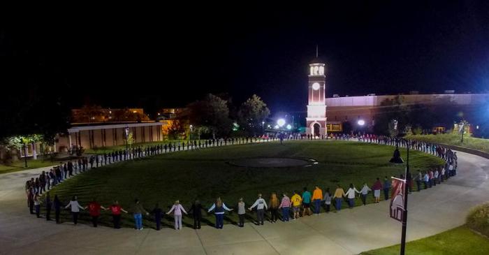 Students and members of the Freed-Hardeman University in Henderson, Tennessee, on October 14, 2015, in prayer for American missionary Roberta Edwards, 55, who was gunned down in Haiti on Saturday.