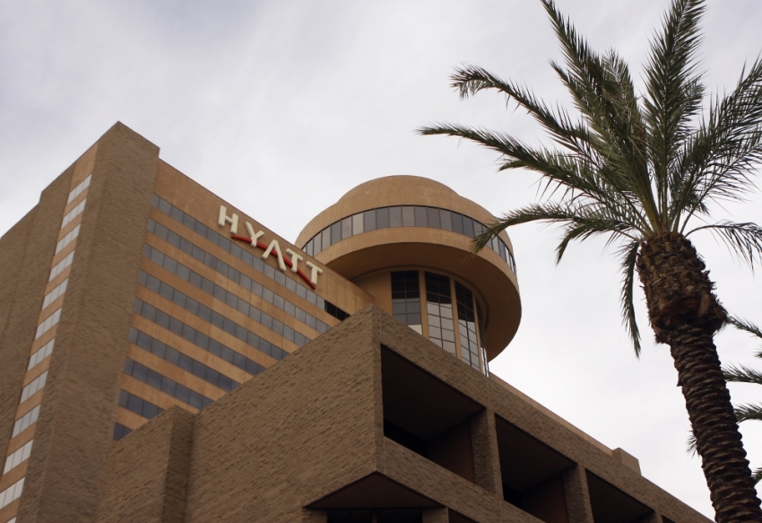 Signage for the Hyatt Hotel is advertised in Phoenix, Arizona, November 4, 2009. Hyatt plans to sell 38 million shares for between and each under the ticker "H" (H.N) on the New York Stock Exchange. The full proceeds of the 1 million IPO will go to the Pritzker family, which controls the company.