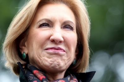 U.S. Republican presidential candidate Carly Fiorina smiles as she is introduced at a house party at the home of former State Senator Bob Clegg in Hudson, New Hampshire, October 3, 2015.