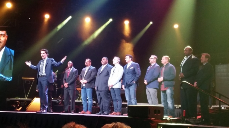 Lakewood Church pastor Joel Osteen is joined on stage by local New York pastors during the afternoon session for Night of Hope at the Barclays Center in Brooklyn, New York on October 16, 2015.