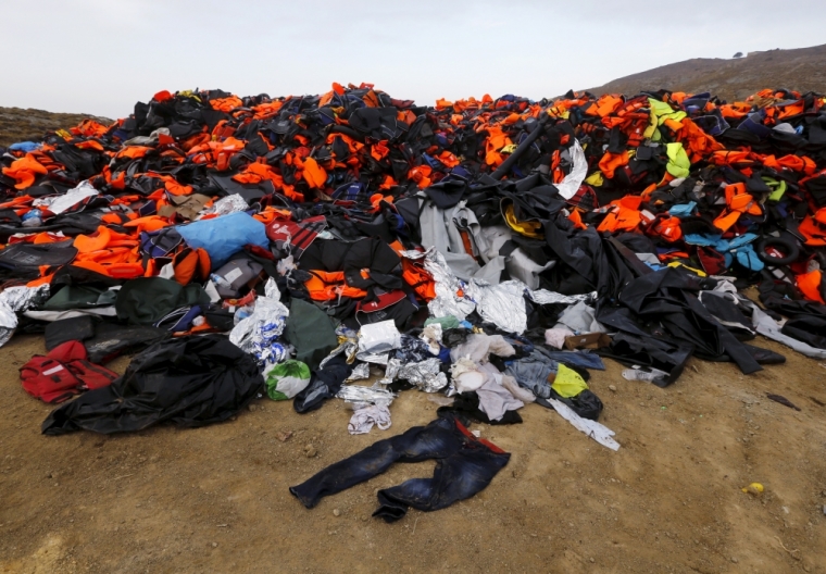 Thousants of life vests left by migrants and refugees are piled up at a garbage dump site on the Greek island of Lesbos, October 19, 2015. Thousands of refugees - mostly fleeing war-torn Syria, Afghanistan and Iraq - attempt daily to cross the Aegean Sea from nearby Turkey, a short trip but a perilous one in the inflatable boats the migrants use, often in rough seas.Almost 400,000 people have arrived in Greece this year, according to the U.N. refugee agency UNHCR, overwhelming the cash-strapped nation's ability to cope.