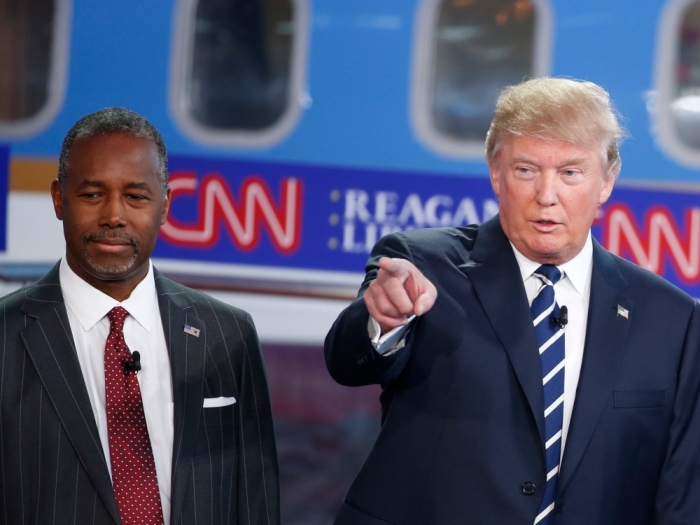 Republican U.S. presidential candidates (L-R) Dr. Ben Carson, businessman Donald Trump and former Florida Governor Jeb Bush talk before the start of the second official Republican presidential candidates debate of the 2016 U.S. presidential campaign at the Ronald Reagan Presidential Library in Simi Valley, California, United States, September 16, 2015.