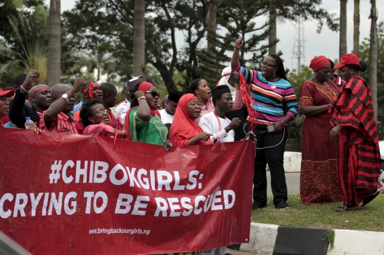 Bring Back Our Girls campaigners take part in a protest procession marking the 500th day since the abduction of girls in Chibok, along a road in Abuja, August 27, 2015. The Islamist militant group Boko Haram kidnapped some 270 girls and women from a school in Chibok a year ago. More than 50 eventually escaped, but at least 200 remain in captivity, along with scores of other girls kidnapped before the Chibok girls.