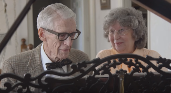 Two 80-something grandparents play the piano on their 60th wedding anniversary.