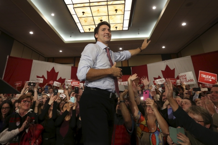 Liberal leader and Canada's Prime Minister-designate Justin Trudeau takes the stage during a rally in Ottawa, Ontario, October 20, 2015. Trudeau, having trounced his Conservative rivals, will face immediate pressure to deliver on a swathe of election promises, from tackling climate change to legalizing marijuana.
