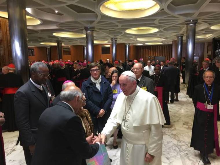 Pope Francis mingling with people in the coffee break, World Synod of the Catholic Church, Vatican City, October 23, 2015.