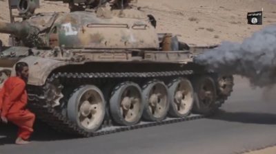 An alleged Syrian soldier is run over by a tank driven by an Islamic State militant in an execution video released by the terrorist group on October 24, 2015.