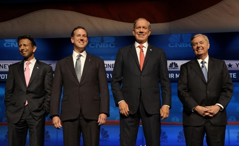 Republican U.S. presidential candidates (L-R) Louisiana Governor Bobby Jindal, former Senator Rick Santorum, former New York Governor George Pataki and Rep. Lindsey Graham pose while attending a forum for lower polling candidates held by CNBC before their U.S. Republican presidential candidates debate in Boulder, Colorado October 28, 2015.