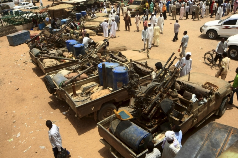 People gather to look at vehicles and weapons of the Justice and Equality Movement rebels that were on display, after victory celebrations by the Sudanese Armed Forces and the Rapid Support Forces, in Niyala Capital of South Darfur, May 4, 2015.