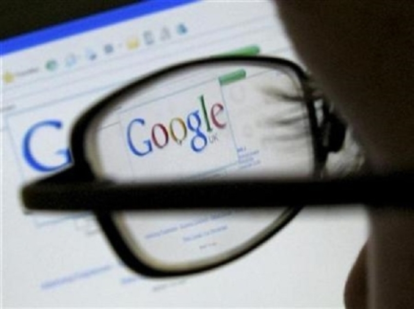 A Google search page is seen through the spectacles of a computer user in Leicester, central England July 20, 2007.