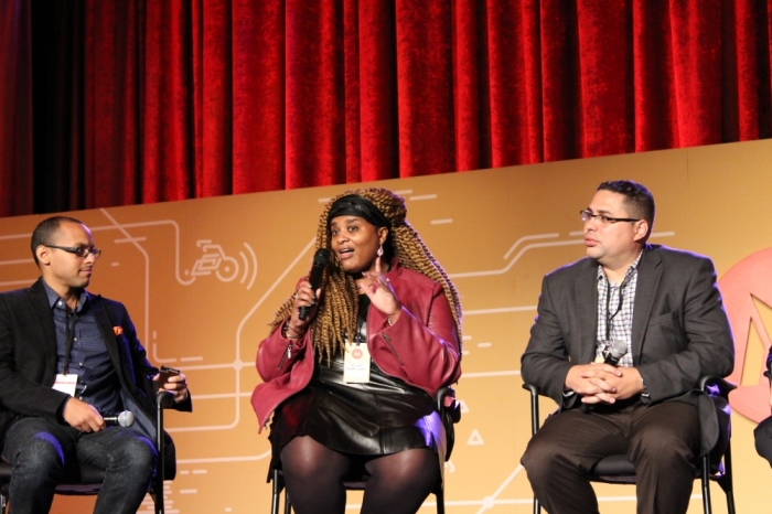 Froswa' Booker-Drew, national community engagement director of World Vision in Dallas, Texas (c) makes a point during a discussion on racial reconciliation at Movement Day 2015 in New York City on October 29, 2015. Rich Villodas, lead pastor, New Life Fellowship Church, Elmhurst, New York (r) and Gabriel Salguero, president of the National Latino Evangelical Coalition (NaLEC) listen.