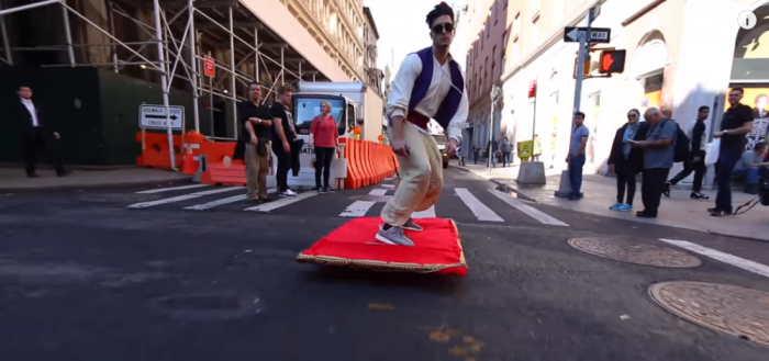 A modern day Aladdin rides a magic carpet as part of a prank in New York City.
