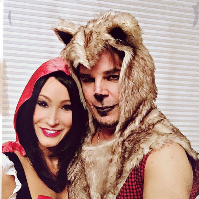Televangelist Paula White (L) and her husband, rocker Jonathan Cain (R), dressed as little Red Riding Hood and the Big Bad Wolf, respectively, for Halloween.