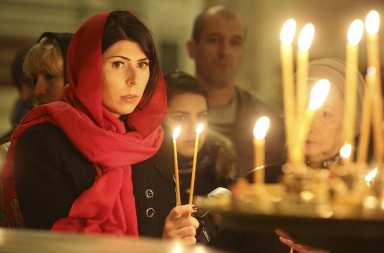 People attend a religious service commemorating victims of a Russian airliner which crashed in Egypt, at St. Isaac's Cathedral in St. Petersburg, Russia November 8, 2015. An Airbus A321, operated by Russian airline Kogalymavia under the brand name Metrojet, crashed on October 31 shortly after taking off from the Red Sea resort of Sharm al-Sheikh on its way to St. Petersburg, killing all 224 people on board.