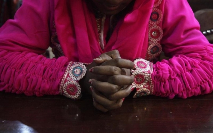 A Pakistani Christian woman attends a mass on Christmas day in Lahore December 25, 2012.