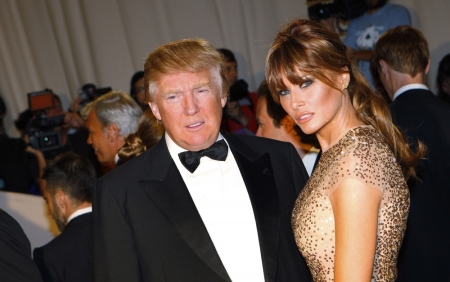 Real estate magnate and television personality Donald Trump and his wife Melania stand on the red carpet at the Metropolitan Museum of Art Costume Institute Benefit celebrating the opening of the exhibition "Alexander McQueen: Savage Beauty" in New York, May 2, 2011.