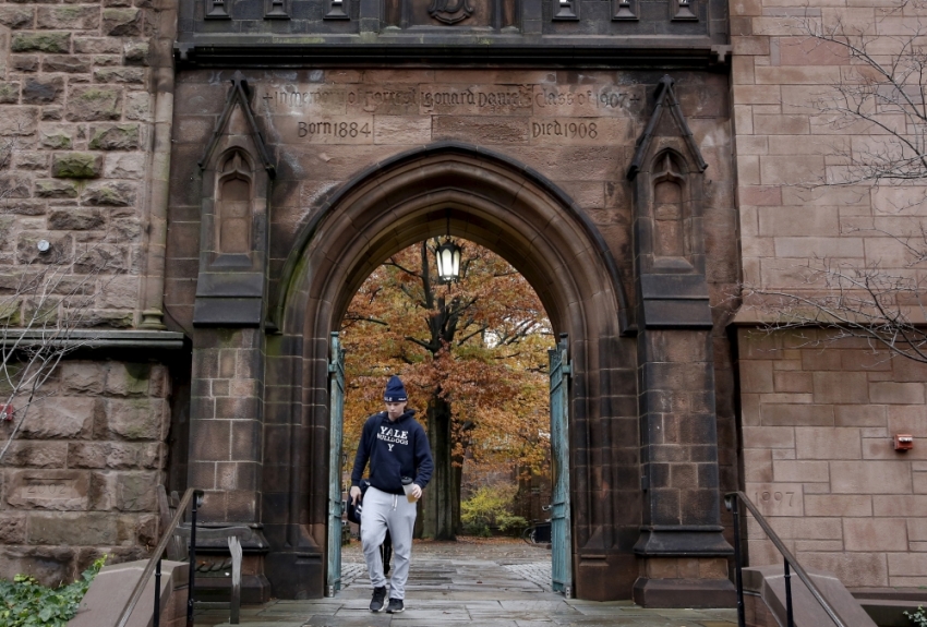 A student walks on the campus of Yale University in New Haven, Connecticut. 