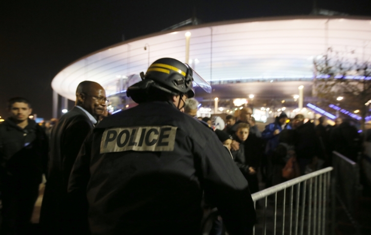 Police control crowds leaving the Stade de France where explosions were reported to have detonated outside the stadium during the France vs German friendly match near Paris, November 13, 2015.