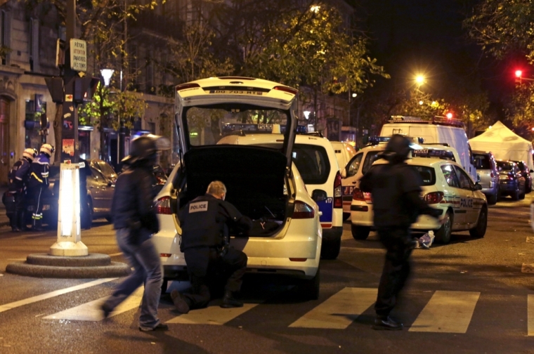 French police secure the area near the Bataclan concert hall following fatal shootings in Paris, France, November 13, 2015.