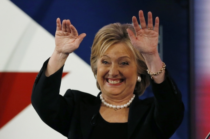 Democratic U.S. presidential candidate and former Secretary of State Hillary Clinton waves to someone in the audience during a break in the second official 2016 U.S. Democratic presidential candidates debate in Des Moines, Iowa, November 14, 2015.