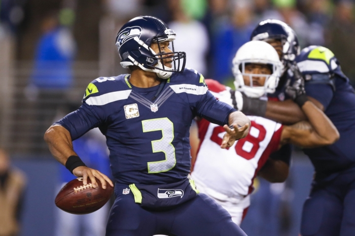 Seattle Seahawks quarterback Russell Wilson (3) looks to pass against the Arizona Cardinals during the second quarter at CenturyLink Field, Seattle, Washington, November 16, 2015.
