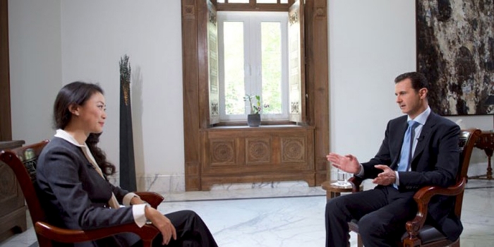 Syria's President Bashar al-Assad speaks during an interview with a journalist from the Chinese Phoenix Television Channel in Damascus, in this handout picture provided by SANA on November 22, 2015.