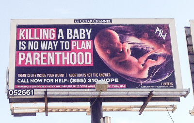 Billboard reading 'Killing A Baby Is No Way To Plan Parenthood' pictured next to an eleven week fetus, erected in Columbus, Ohio, in November 2015.