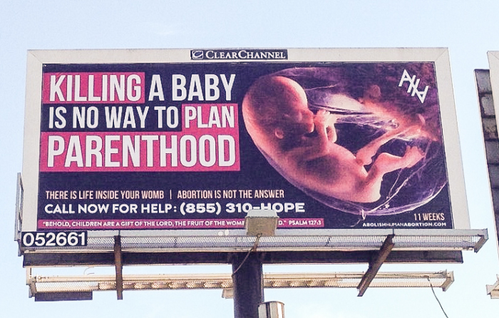 Billboard reading 'Killing A Baby Is No Way To Plan Parenthood' pictured next to an eleven week fetus, erected in Columbus, Ohio, in November 2015.