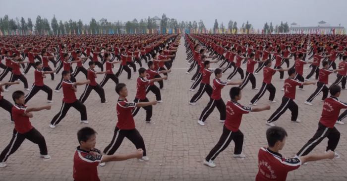 Tens of thousands of children at a martials arts academy in China practice Kung Fu.
