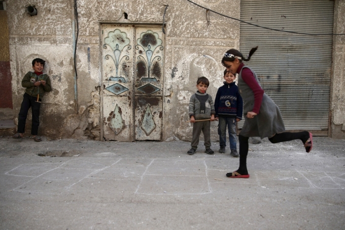Children play in the Douma neighborhood of Damascus, Syria, November 26, 2015.