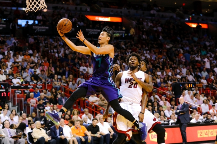 Charlotte Hornets guard Jeremy Lin (7) drives to the basket as Miami Heat forward Justise Winslow (20) looks on during the first half at American Airlines Arena, Miami, Florida, October 28, 2015.