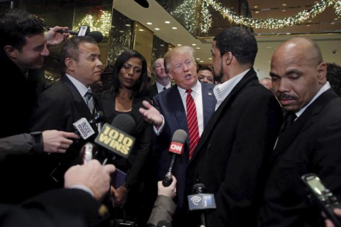 Presidential candidate Donald Trump speaks to the media after meeting with a group of black pastors at his office in the Manhattan borough of New York November 30, 2015.