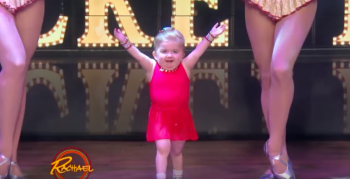 Audrey Nethery, a 7-year-old with a rare bone disorder, dances with the Rockettes on a November 2015 episode of the Rachael Ray Show.