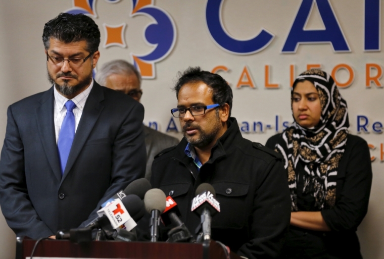 Farhan Khan (C), brother-in-law of San Bernardino shooting suspect Syed Farook, speaks at the Council on American-Islamic Relations during a news conference in Anaheim, California, December 2, 2015.