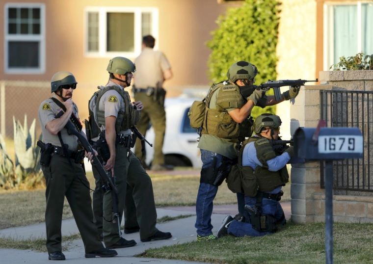 Police officers conduct a manhunt after a shooting rampage in San Bernardino, California, December 2, 2015.