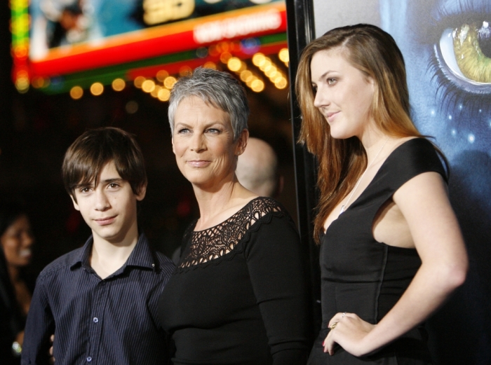 Jamie Lee Curtis and her husband Christopher Guest adopted son Thomas (L) and daughter Annie (R).