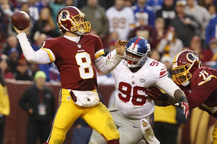 Washington Redskins quarterback Kirk Cousins (8) throws the ball as New York Giants defensive tackle Jay Bromley (96) chases in the fourth quarter at FedEx Field, Landover, Maryland, November 29, 2015. The Redskins won 20-14.